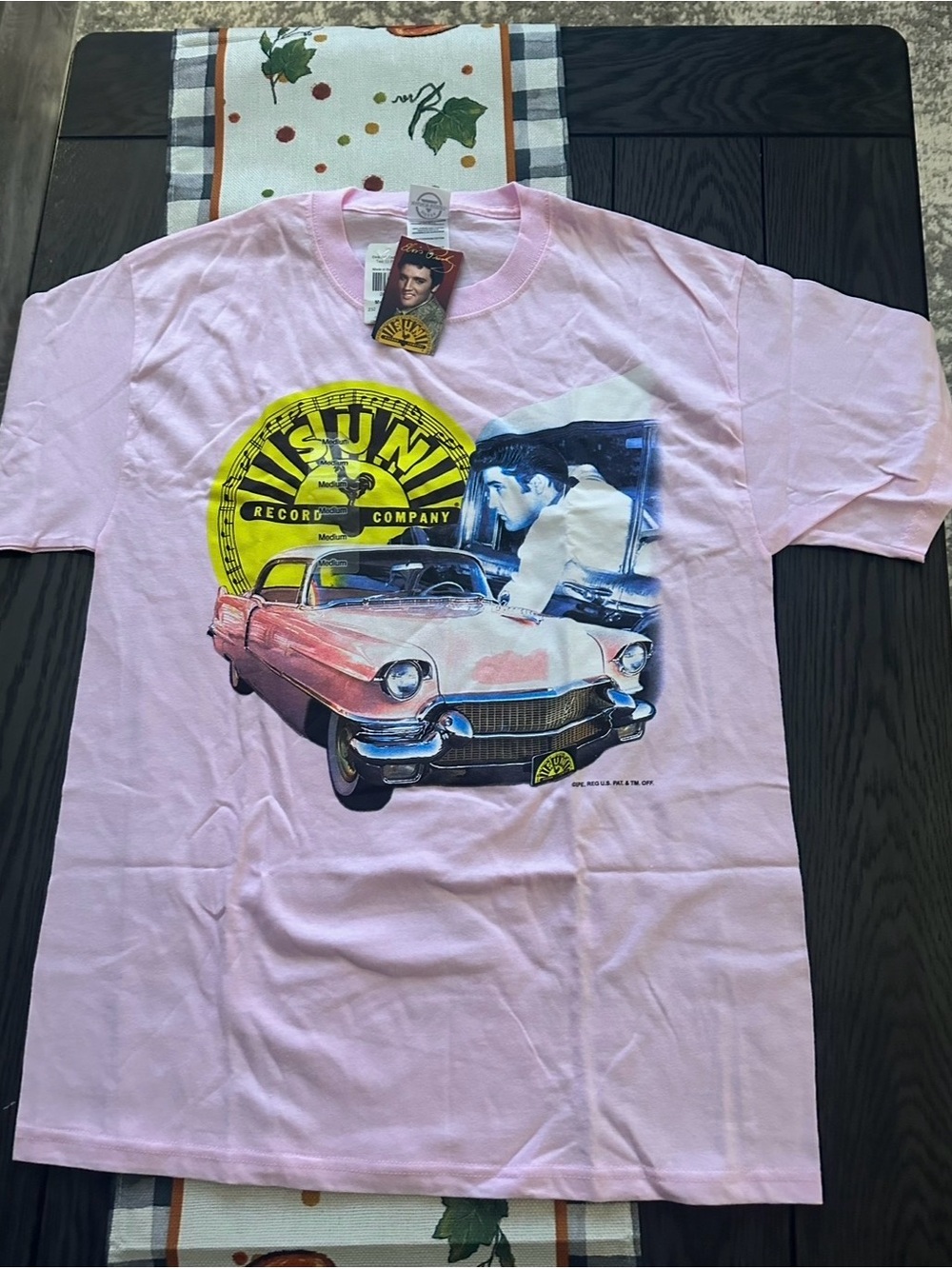 Women’s Elvis Pink Cadillac" T-shirt size medium new with tags.